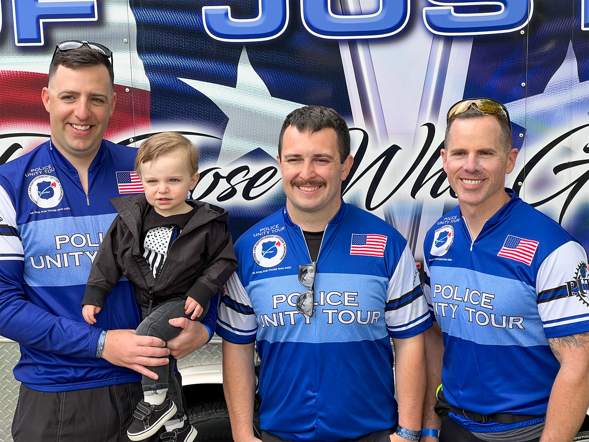 Police Unity Tour 2023 officers pose for photo.
